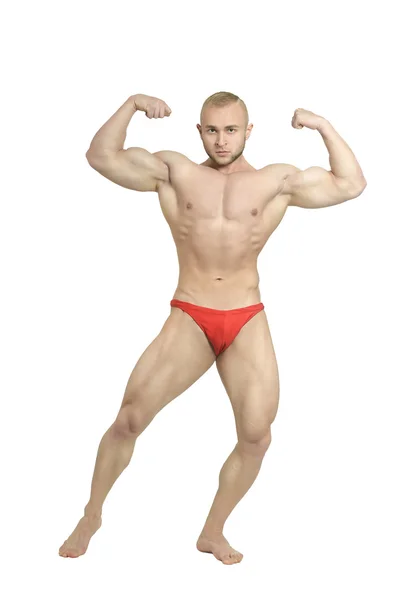 Bodybuilder poserar hans muskler — Stockfoto
