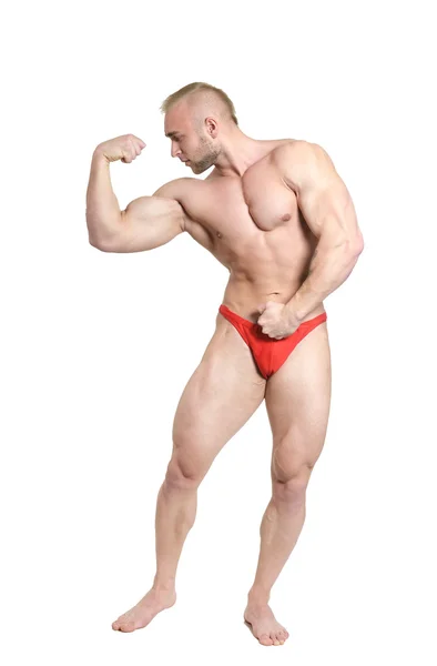 Bodybuilder poseren zijn spieren — Stockfoto