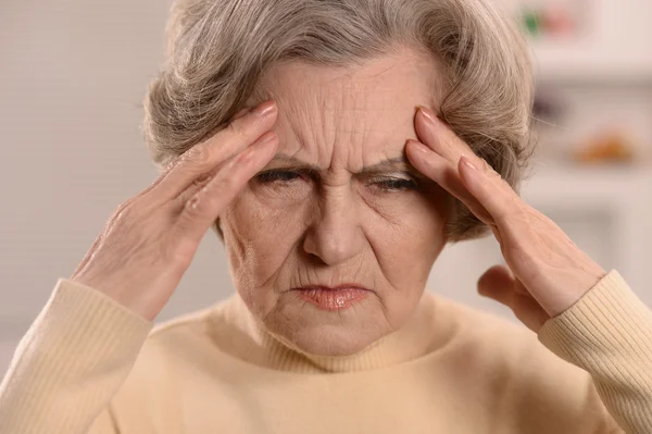 Old lady feels sick at home — Stock Photo, Image