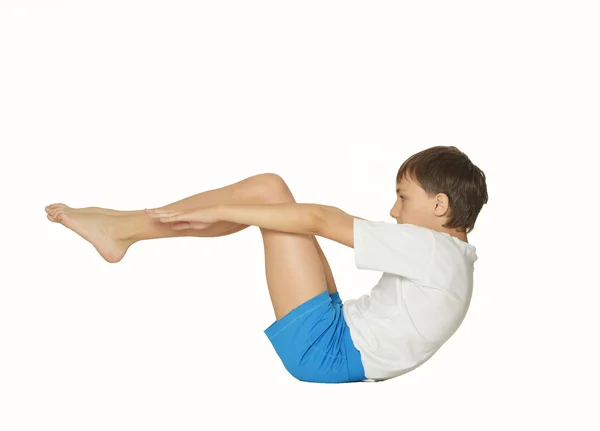 Mladý chlapec dělat cvičení — Stock fotografie