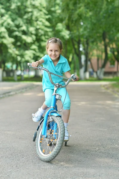 Little girl with bicycle — Stock Photo, Image
