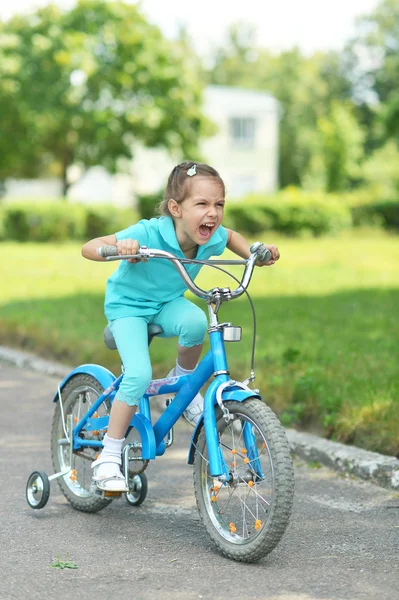 Little girl with bicycle — Stock Photo, Image