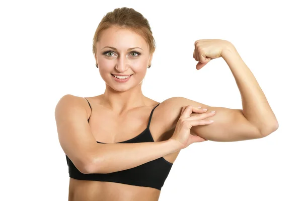 Kobieta pokazuje biceps — Zdjęcie stockowe
