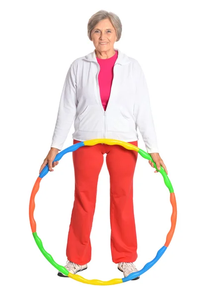 Senior woman exercising with hoop — Stock Photo, Image