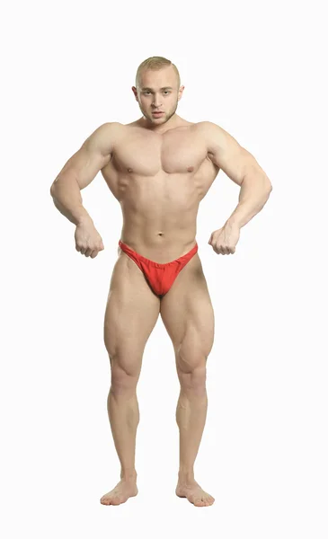 Bodybuilder posiert seine Muskeln — Stockfoto