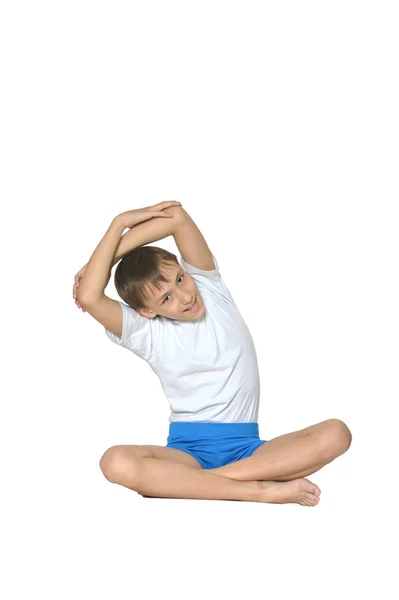 Young boy doing exercises — Stock Photo, Image