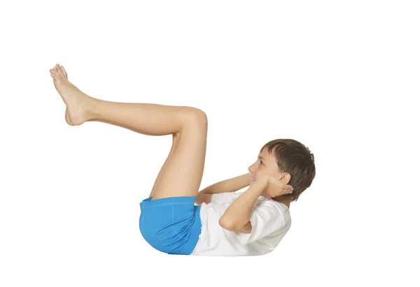 Young boy doing exercises — Stock Photo, Image