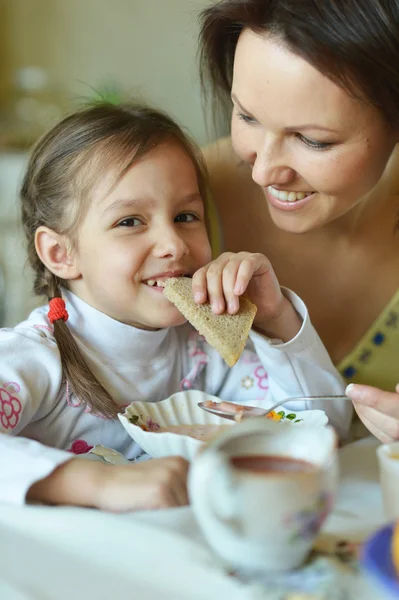 Mother and daughter eating soup Royalty Free Stock Images