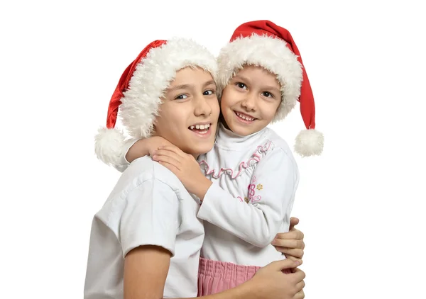 Crianças em chapéus de Natal — Fotografia de Stock