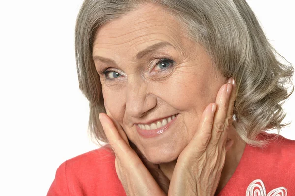 Senior woman in red dress — Stock Photo, Image