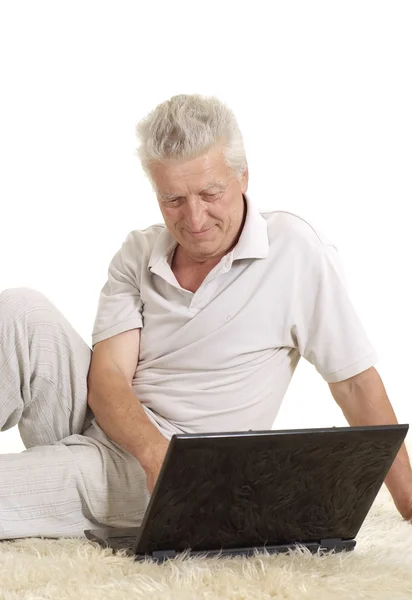 Mature man relaxing  with laptop — Stock Photo, Image