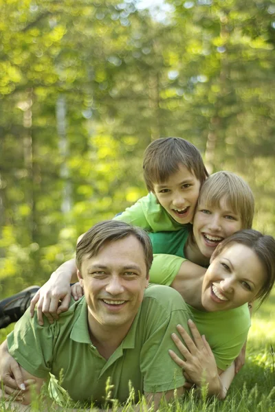 Family in the summer park — Stock Photo, Image