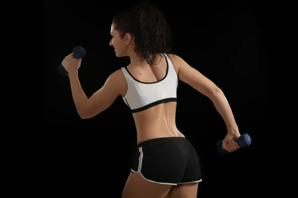 Young woman with dumbbells — Stock Photo, Image