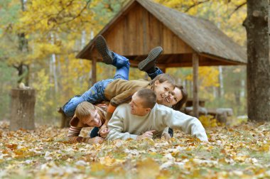 Family   in autumn forest clipart
