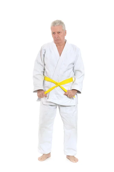 Senior man in karate pose — Stockfoto