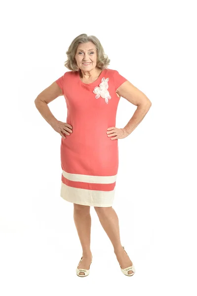 Senior vrouw in rode jurk — Stockfoto