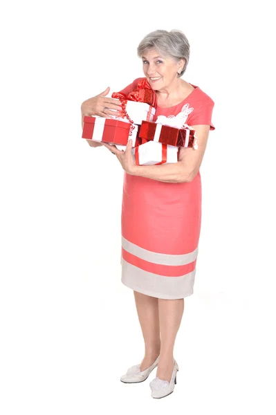 Elderly woman holding gifts — Stock Photo, Image