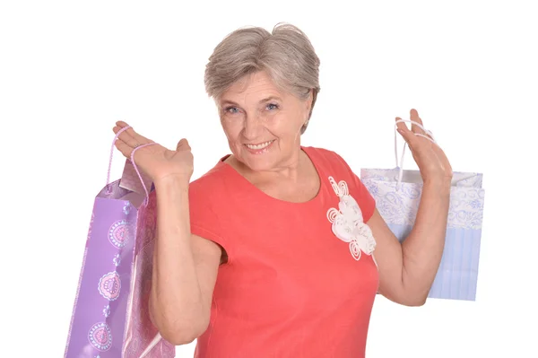 Old woman with shopping bags — Stock Photo, Image