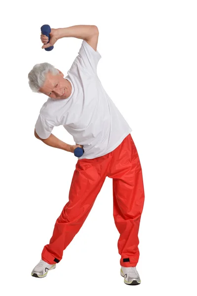 Homem sênior exercitando com halteres — Fotografia de Stock