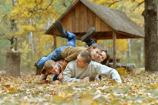 Family   in autumn forest — Stock Photo, Image