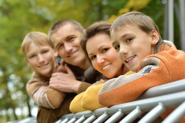 Family relaxing in autumn park — Stock Photo, Image