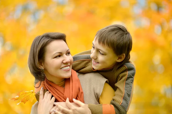 Mother with  boy  in autumn — Stock Photo, Image