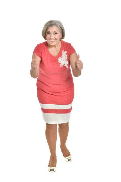 Idős nő piros ruhában — Stock Fotó