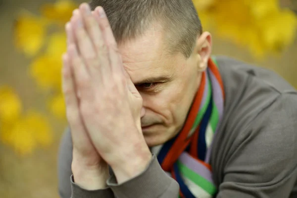 Sad man in  early autumn — Stock Photo, Image