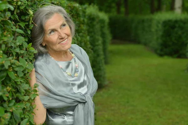 Elderly woman  in summer — Stock Photo, Image