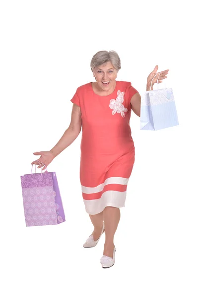 Old woman with shopping bags — Stock Photo, Image