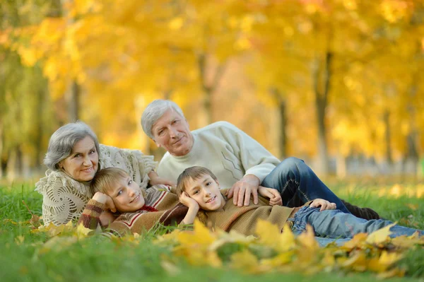 Grandparents and grandchildren in autumn — Stock Photo, Image