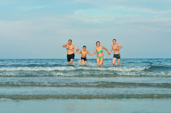 Family at beach  in summer — Stock Photo, Image