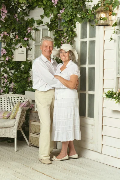 Beautiful elderly couple on veranda — Stock Photo, Image