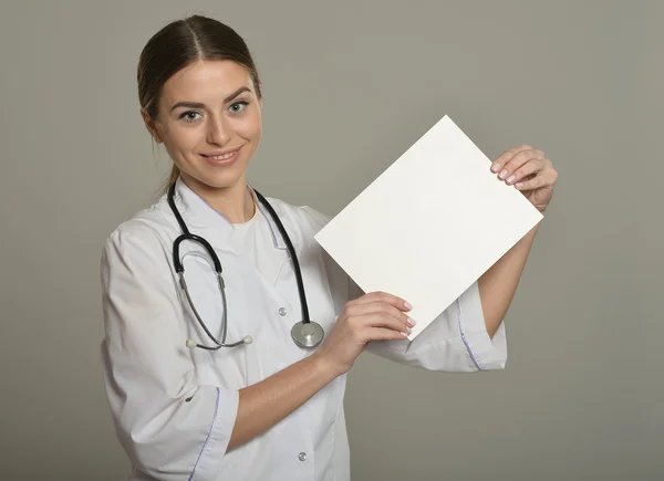 Female doctor with white list — Stock Photo, Image