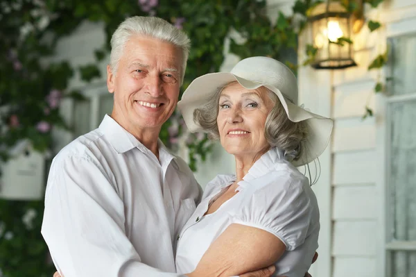 Beautiful elderly couple on veranda — Stock Photo, Image