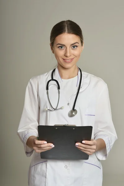 Female doctor with a folder — Stock Photo, Image