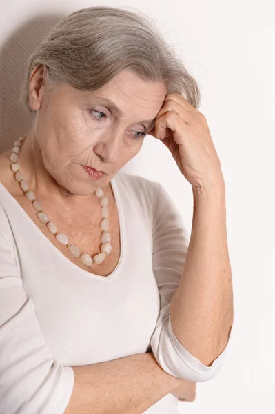 Thoughtful sad elderly woman — Stock Photo, Image