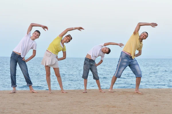 Happy family doing  exercises — Stock Photo, Image