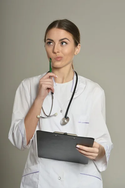 Female doctor with a folder — Stock Photo, Image
