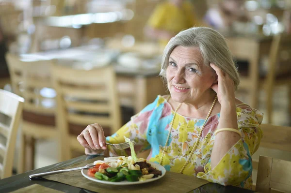 Beautiful elderly woman in cafe — Stock Photo, Image