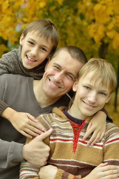 Family relaxing in autumn park Royalty Free Stock Images