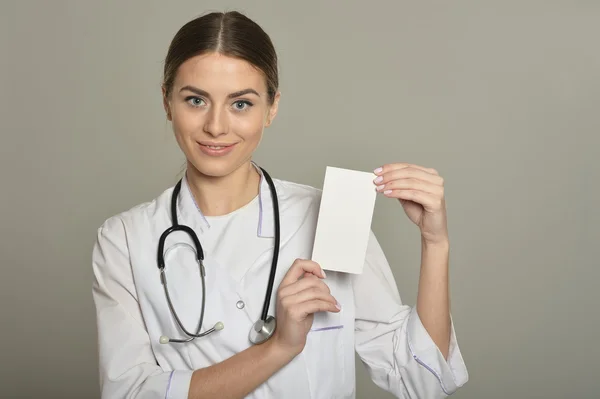 Female doctor with white list — Stock Photo, Image