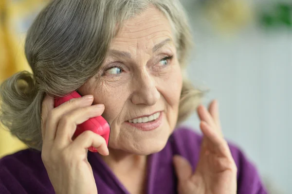 Elderly woman with phone — Stock Photo, Image