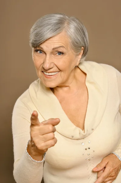 Senior woman pointing — Stock Photo, Image