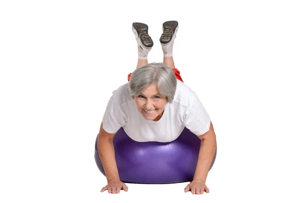 Senior woman exercising with ball — Stock Photo, Image