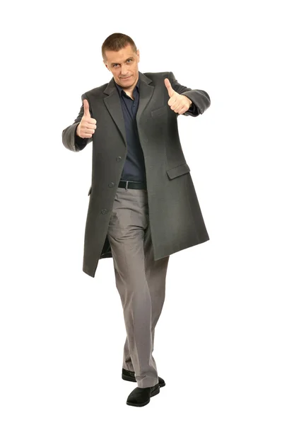 Man in coat showing thumbs up — Stock Photo, Image