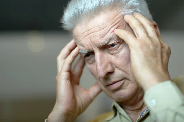 Elderly man with  headache — Stock Photo, Image