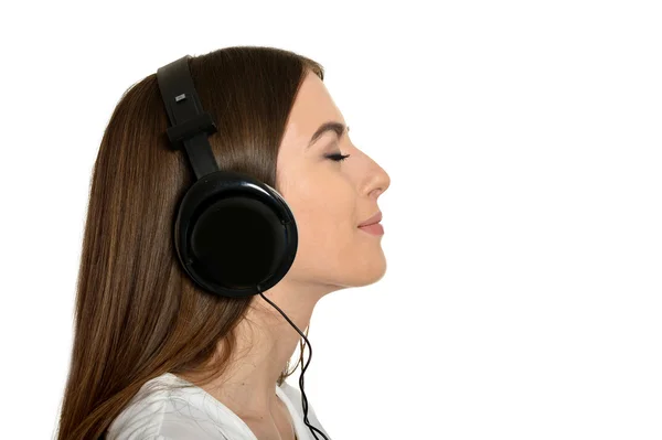 Dziewczyna słuchania muzyki w słuchawkach. — Zdjęcie stockowe