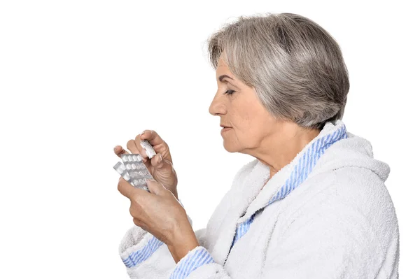 Elderly woman taking pills — Stock Photo, Image