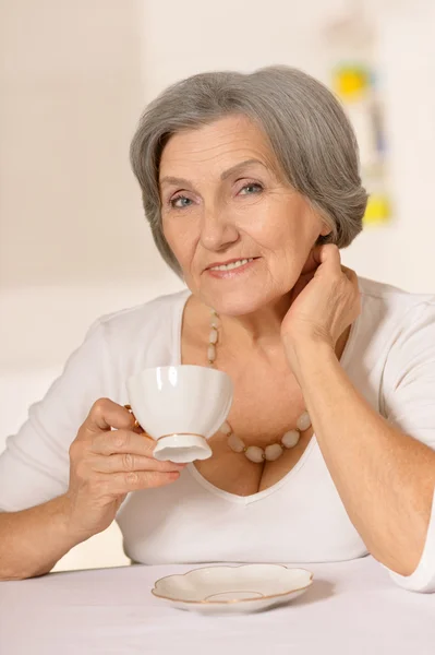 Senior woman  with cup — Stock Photo, Image